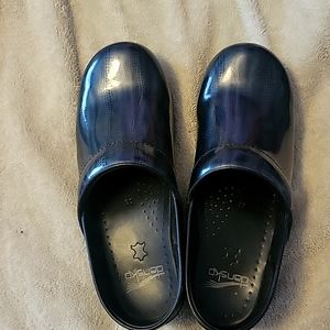 Dansko patent leather clogs